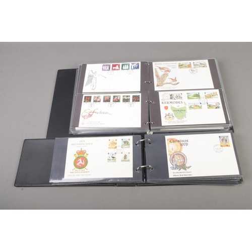 79 - Two albums of Isle of man first day covers, 148 examples.