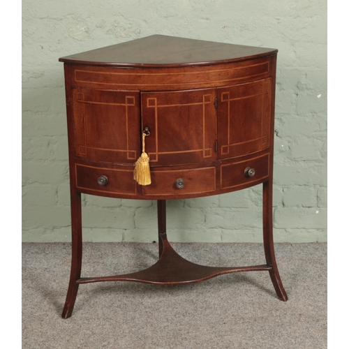 498 - A Victorian mahogany inlaid corner wash stand, with cupboard door over singular draw flanked by to f... 