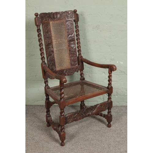 500 - A profusely carved Victorian oak elbow chair with bergere seat and back.

Hx118cm