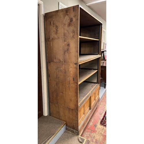 552 - An Elliott & Sons large oak fronted pine stacking shop fitting cabinet, with slatted back. Featuring... 