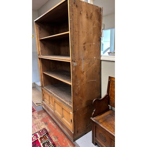 552 - An Elliott & Sons large oak fronted pine stacking shop fitting cabinet, with slatted back. Featuring... 