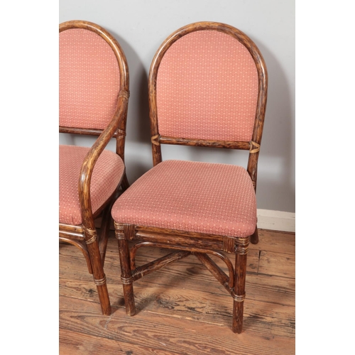 515 - A quality set of six bamboo dining chairs with upholstered seat and back including two carvers.