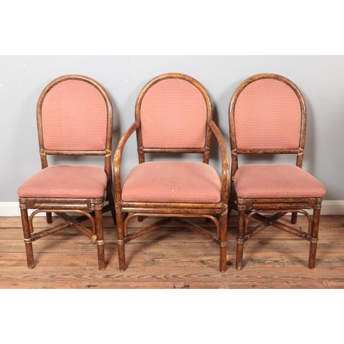 515 - A quality set of six bamboo dining chairs with upholstered seat and back including two carvers.