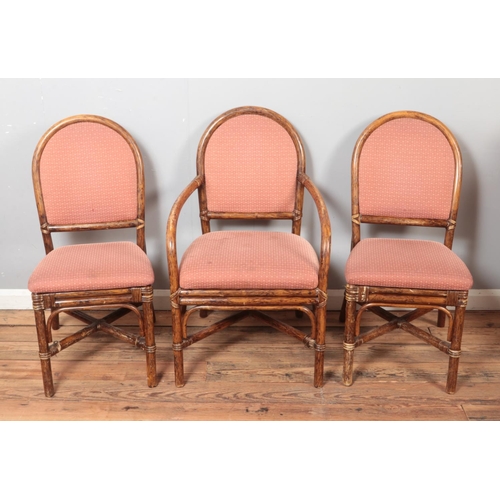 515 - A quality set of six bamboo dining chairs with upholstered seat and back including two carvers.