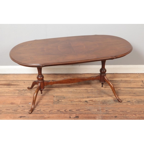 519 - A quarter veneer mahogany coffee table