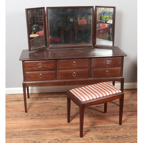 520 - A Stag Minstrel dressing table and stool.