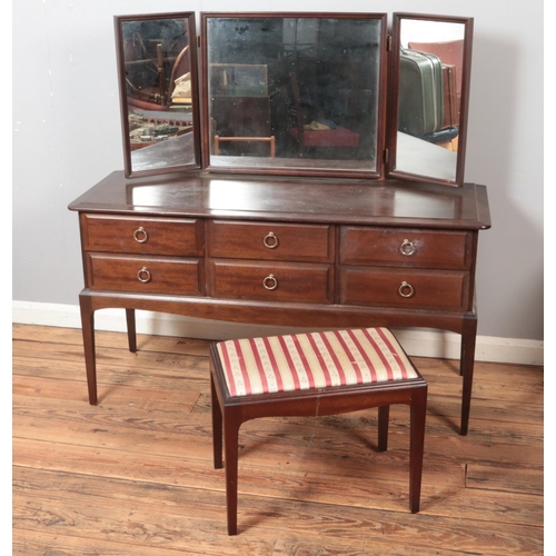 520 - A Stag Minstrel dressing table and stool.