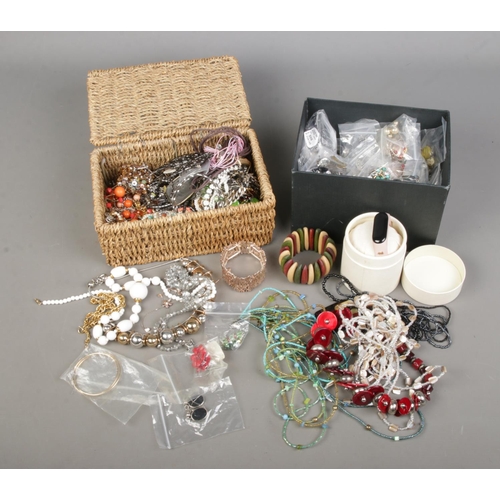 73 - Two boxes of assorted costume jewellery to include large collection of beaded necklaces, earrings, b... 