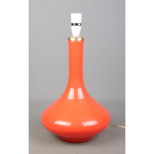 78 - An orange glass table lamp. Height 34cm.