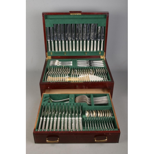 56 - A mahogany cased James Dixon and Sons twelve place canteen of cutlery, with hinged top and lower dra... 