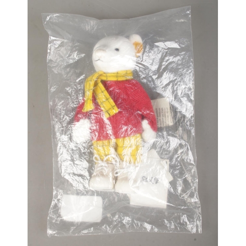 63 - A Steiff Rupert Bear; 653551, in white, still in plastic packing bag. With yellow tag and button in ... 