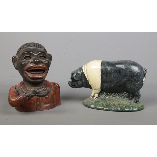 72 - A cast alloy novelty money box, together with a door stop formed as a pig.