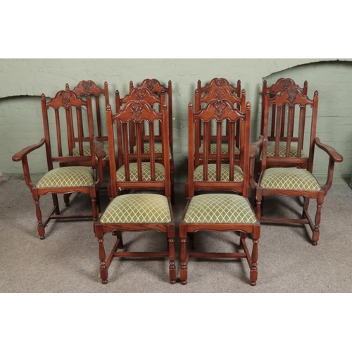 533 - A set of ten oak dining chairs, containing two carvers. Featuring carved detailing to top of backres... 