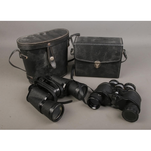 101 - Two pairs of vintage binoculars including a Prinz and a Commodore example.