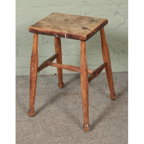 544 - A antique hardwood stool.