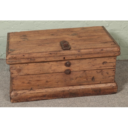 550 - A rustic pine trunk with cast iron hasp lock lid