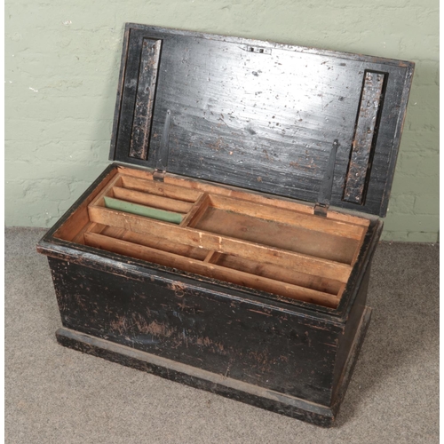 553 - An early 20th century carpenters tool chest with fitted interior.