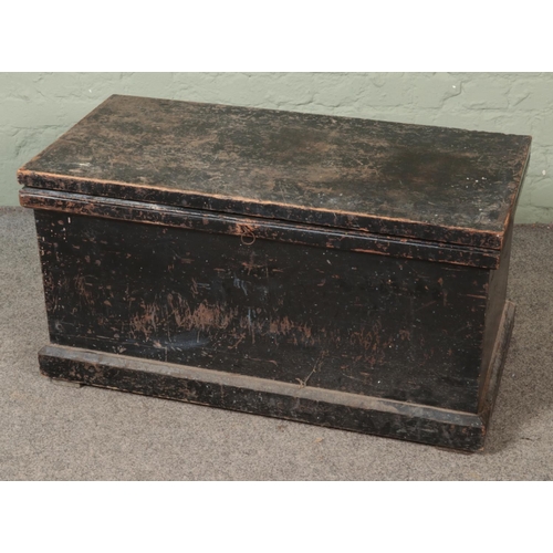 553 - An early 20th century carpenters tool chest with fitted interior.