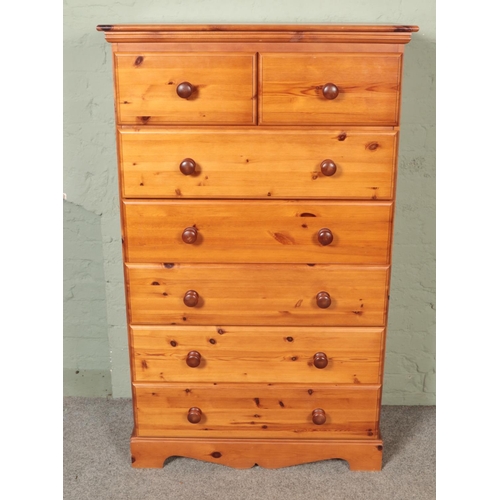 555 - A modern tallboy pine chest of drawers