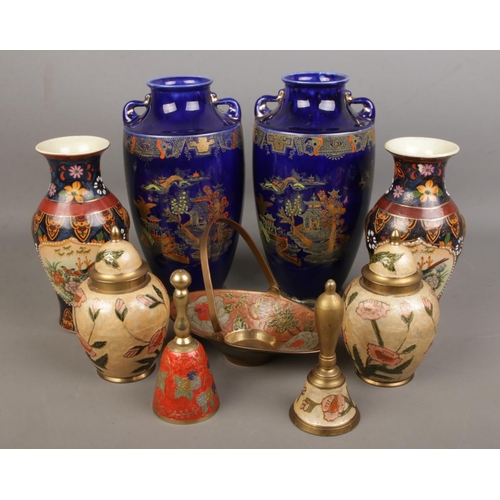 106 - A pair of crown ware porcelain vases together with a larger oriental pair and a pair of enamelled gi... 