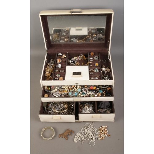 114 - A vintage jewellery box with contents of assorted costume jewellery to include bracelets, earrings, ... 