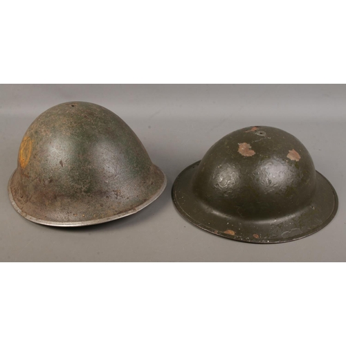 127 - Two British military helmets including a Mk2 and Mk4 example