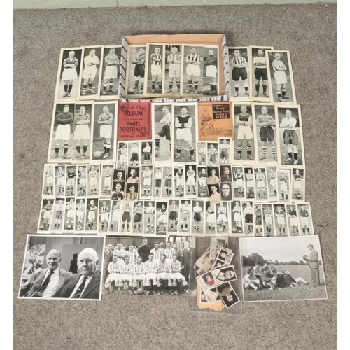 128 - A tray of assorted vintage sporting and football pictures and trade cards, to include two Topical Ti... 