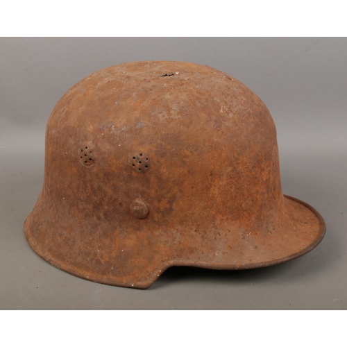 129 - A German military helmet possibly an M34 helmet.