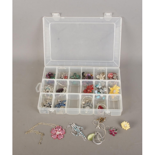 139 - A box of assorted mostly floral costume jewellery to include necklaces, earrings, rings, etc.