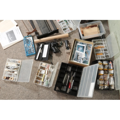 A large collection of assorted model boat building materials, tools and