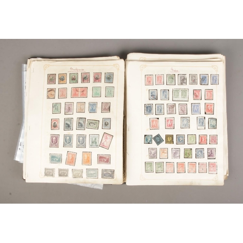 31 - A album containing a good collection of world stamps to include 14 Victorian Penny Reds, Belgian, In... 