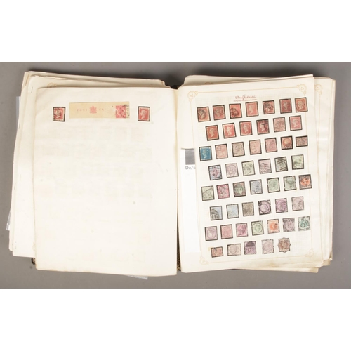 31 - A album containing a good collection of world stamps to include 14 Victorian Penny Reds, Belgian, In... 