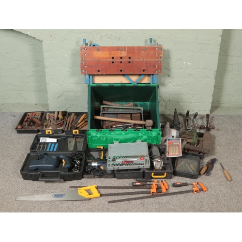 334 - A very large collection of tools, to include Black and Decker Workmate bench, socket set, Performanc... 