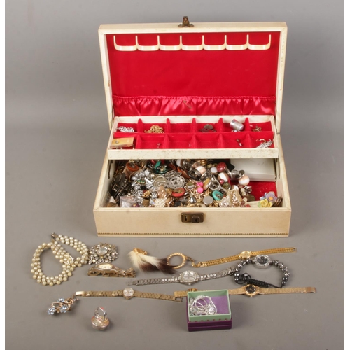 62 - A vintage jewellery box with contents of assorted costume jewellery and ladies wristwatches. Include... 