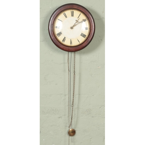 349 - A mahogany postman's alarm clock with roman numeral dial with pendulum.