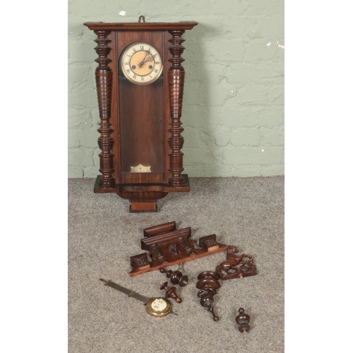 365 - A mahogany case wall clocks with brass pendulum with pot inset marked R-A.