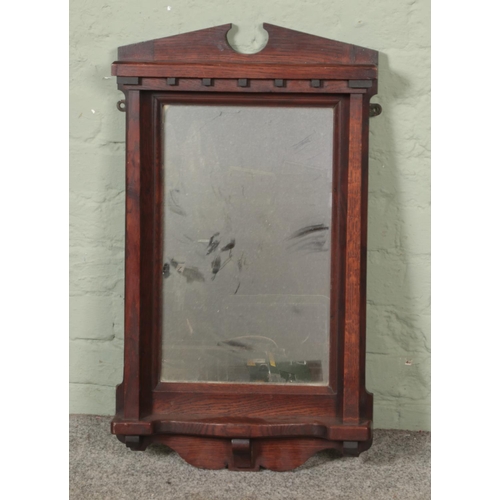 369 - An oak hall mirror

Hx75cm
W42cm