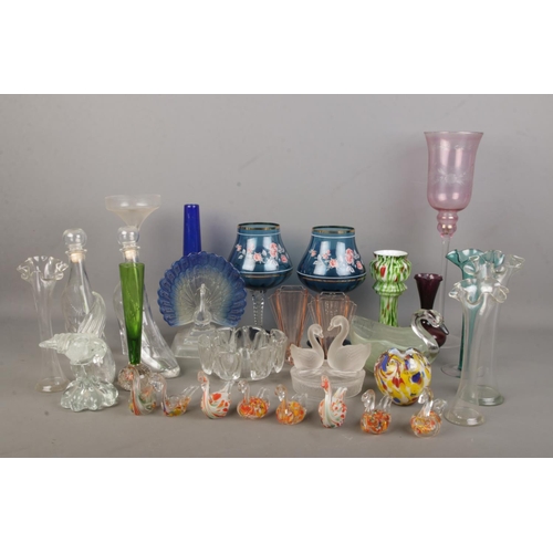 72 - A collection of decorative glassware inlcuding shoe shaped decanters, Murano style birds, coloured t... 