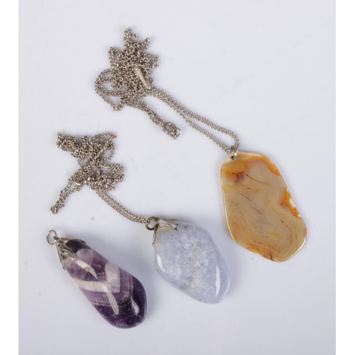 415 - Three polished gemstones pendants to include Blue John and agate examples. Two on white metal chains... 