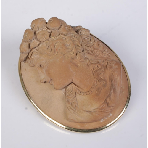 435 - A Victorian Lava cameo brooch of high relief depicting portrait of a maiden set in yellow metal moun... 