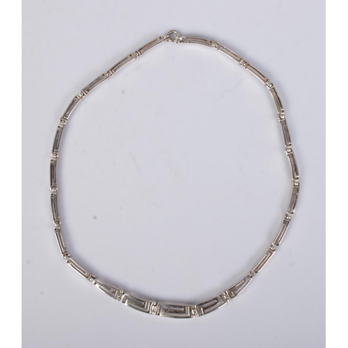 437 - A silver necklace featuring openwork design. Approx. length unclasped 45cm, total weight 25.3g.