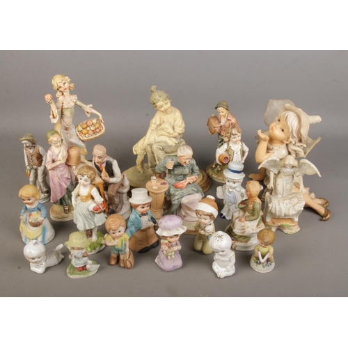 82 - A large collection of vintage figurines.