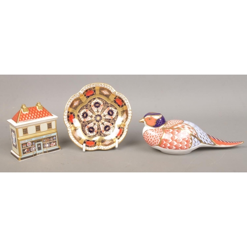 453 - Three pieces of Royal Crown Derby ceramics; consisting of 'The China Shop', pheasant paperweight and... 