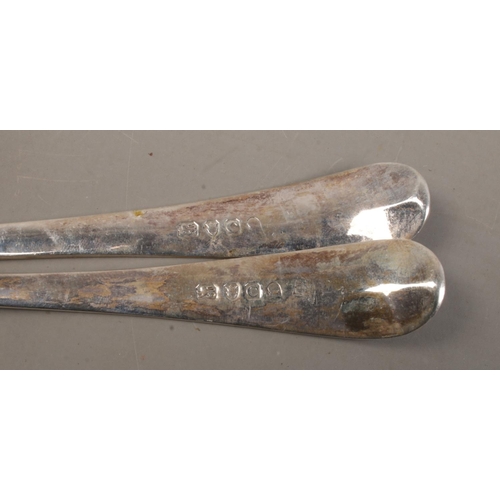 456 - A pair of late Eighteenth Century Georgian table spoons, with floral detailing and 'E' engraved to t... 