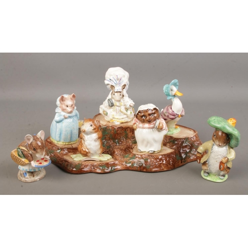 457 - A set of seven Beswick Beatrix Potter figures with Beswick tree stump stand.