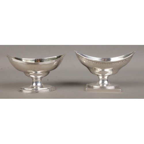 458 - A near pair of large Georgian silver salts, with elliptical bowls, both on stepped oval base; one wi... 