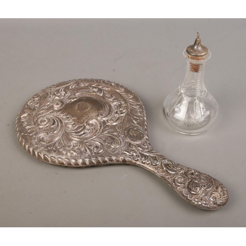 470 - Two pieces of silver to include silver handled mirror (Chester 1905) and Barker Brothers Silver ltd ... 