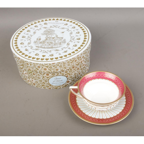 471 - A boxed Wedgwood tea cup and saucer in the Queen of Hearts pattern.