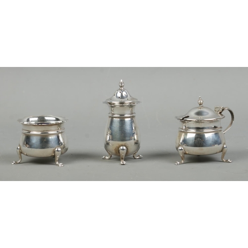 474 - A silver three piece cruet set, including pepperette and preserve pots. Assayed for Birmingham, 1946... 