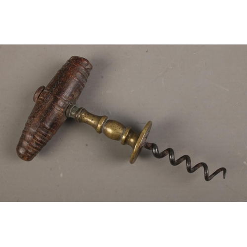 479 - A Henshall type 19th century corkscrew with brass shank design with wood turned handle.